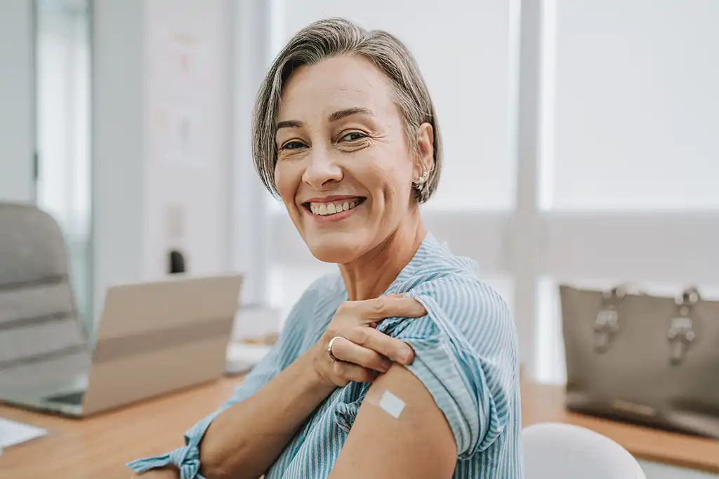woman showing her vaccination