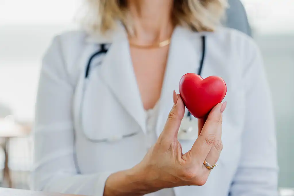 dr holding a heart